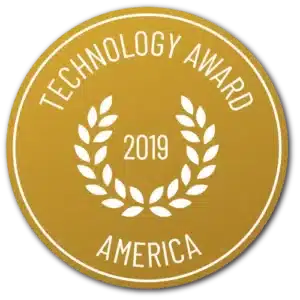 Rond gouden embleem met de opschriften "Technology Award" en "America" in het wit, met een lauwerkrans rond "Vitakruid - Curcuma C3-2X (60 veganistische capsules)" en het jaartal "2019".